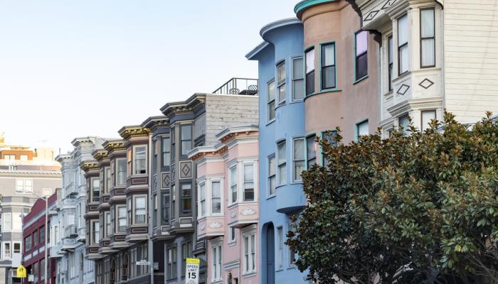 Row of historic pastel colored buildings with classic bay windows on Filbert Street